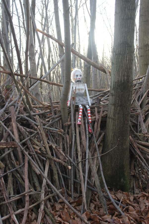 Girl on a Woodpile